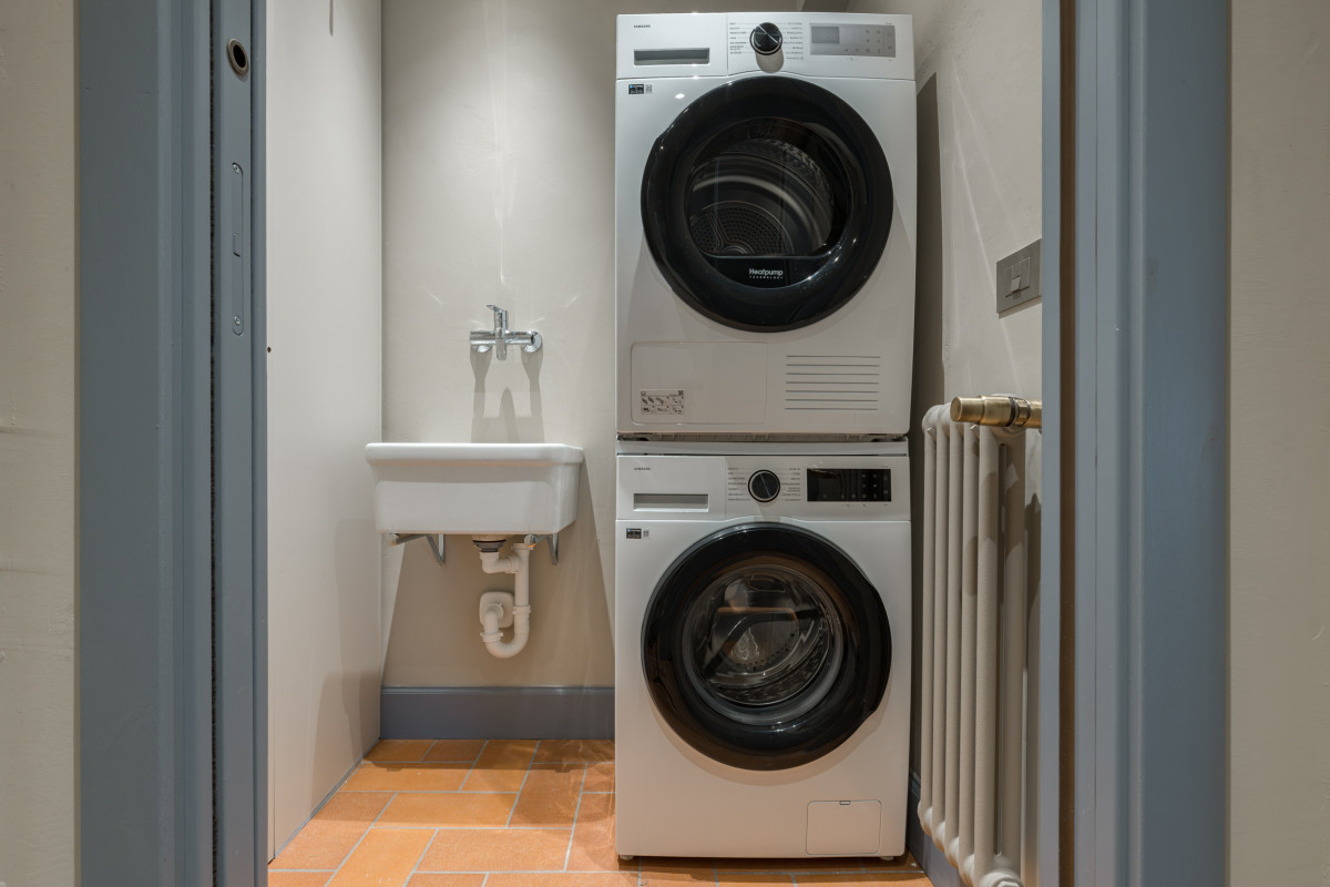 Laundry area with washer and dryer in Florence apartment