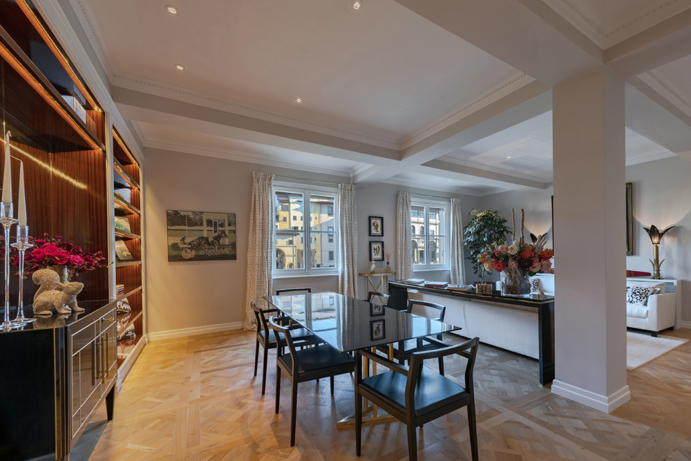 Open living and dining area in Unicko apartment in Florence with elegant interior design