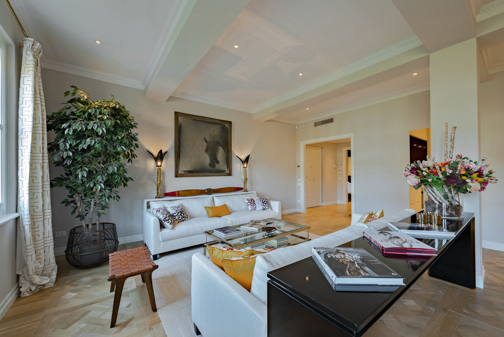 Living room with sofa and designer details in Unicko apartment in Florence