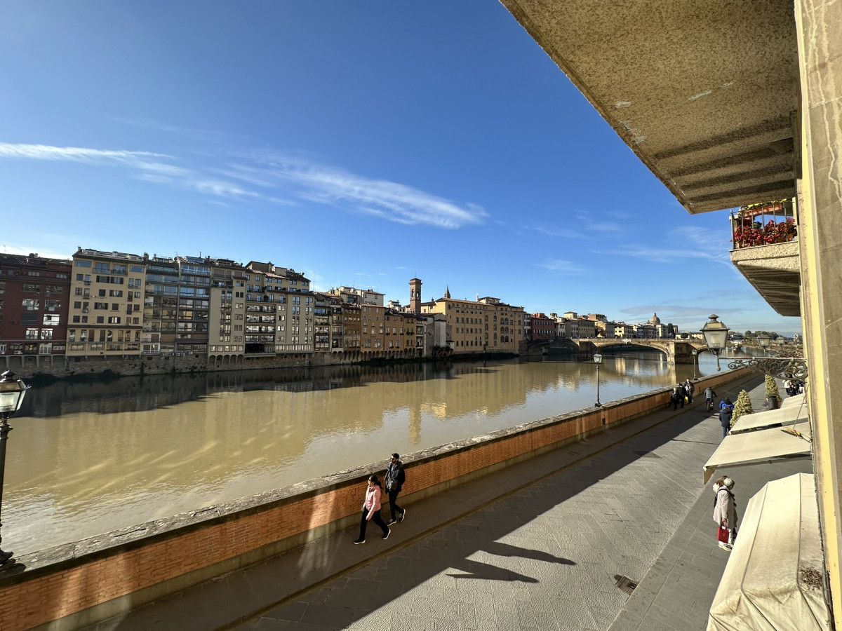 Street view along the Arno River near Ponte Vecchio in Florence
