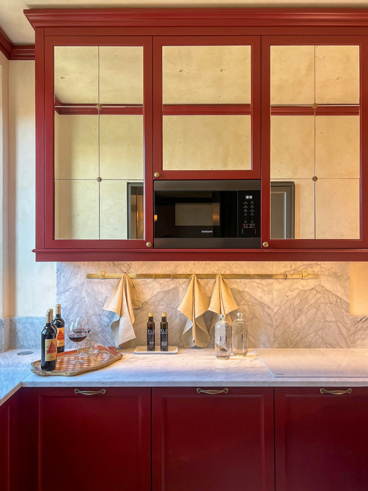 Luxury kitchen in Florence apartment with modern appliances, induction hob and elegant marble countertop