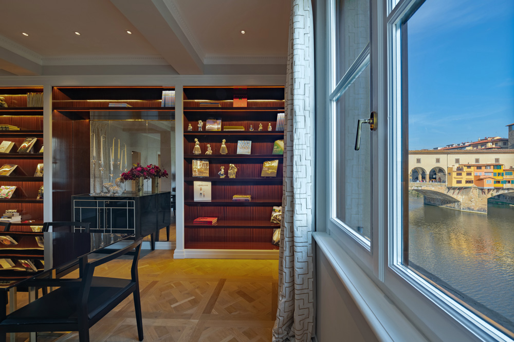 Luxury living room in Unicko apartment in Florence with view of Ponte Vecchio and Arno river