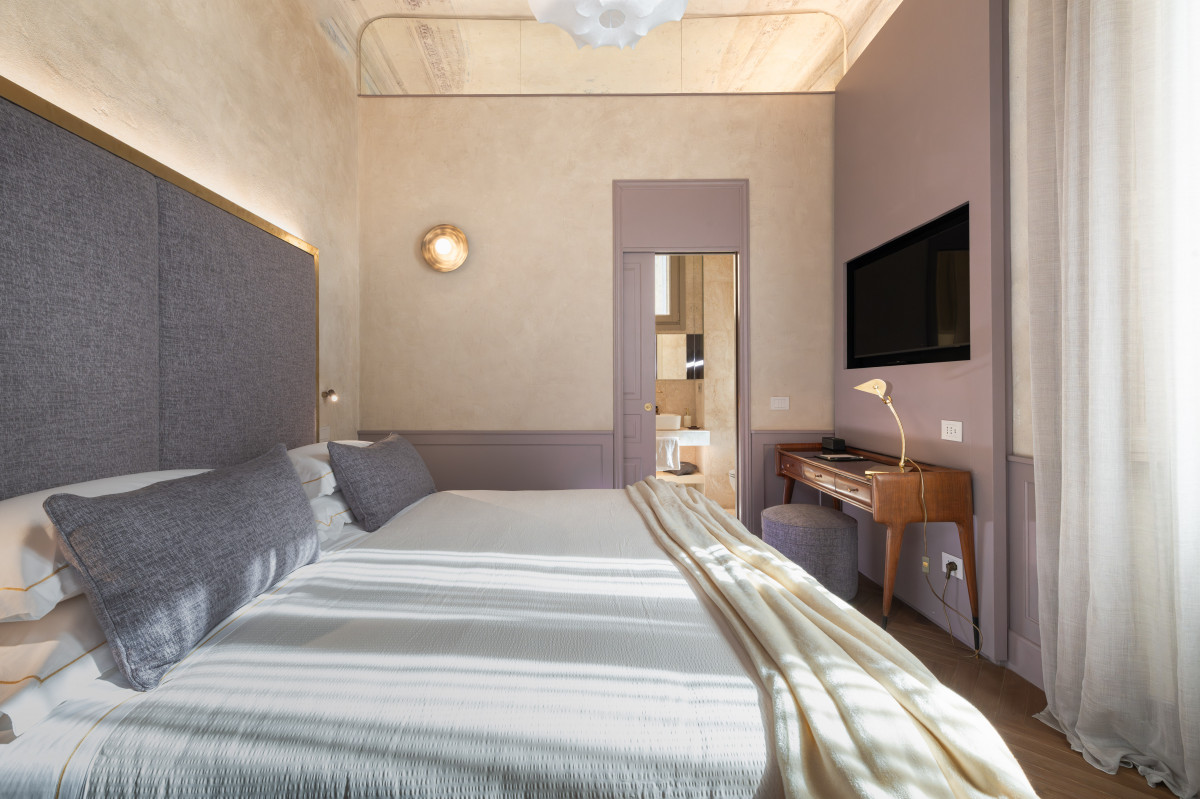 Elegant bedroom in Florence luxury apartment