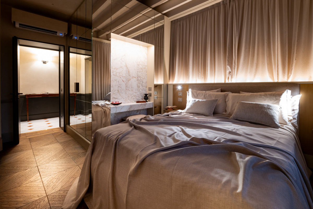 Elegant bedroom in Florence luxury apartment