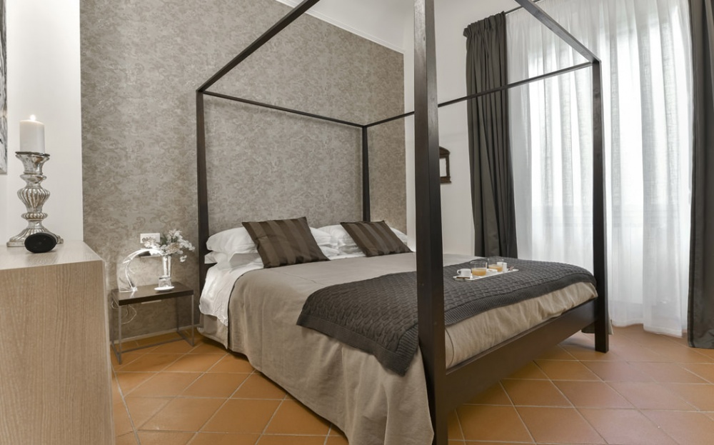 bedroom with modern artwork in Florence apartment