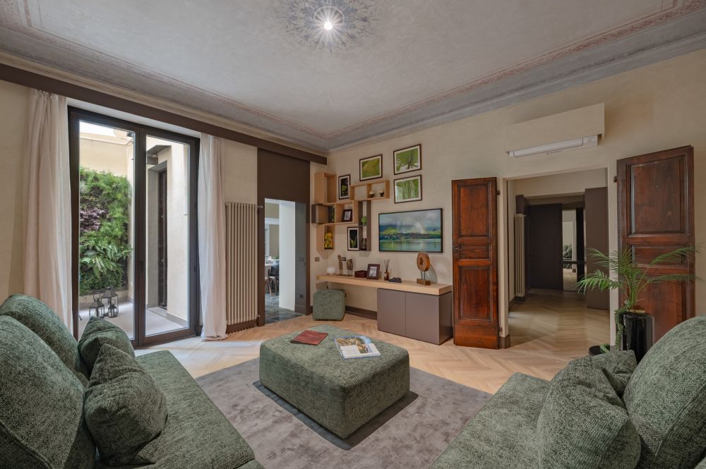 Large luxury living room of the Palazzo Tintori Garden apartment with original and modern materials