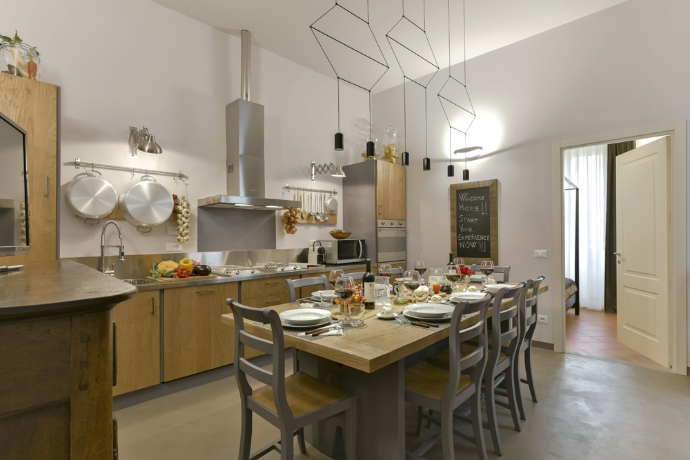 Piazza Pitti 22 apartment's stunning open-plan kitchen and dining area can seat 12 people