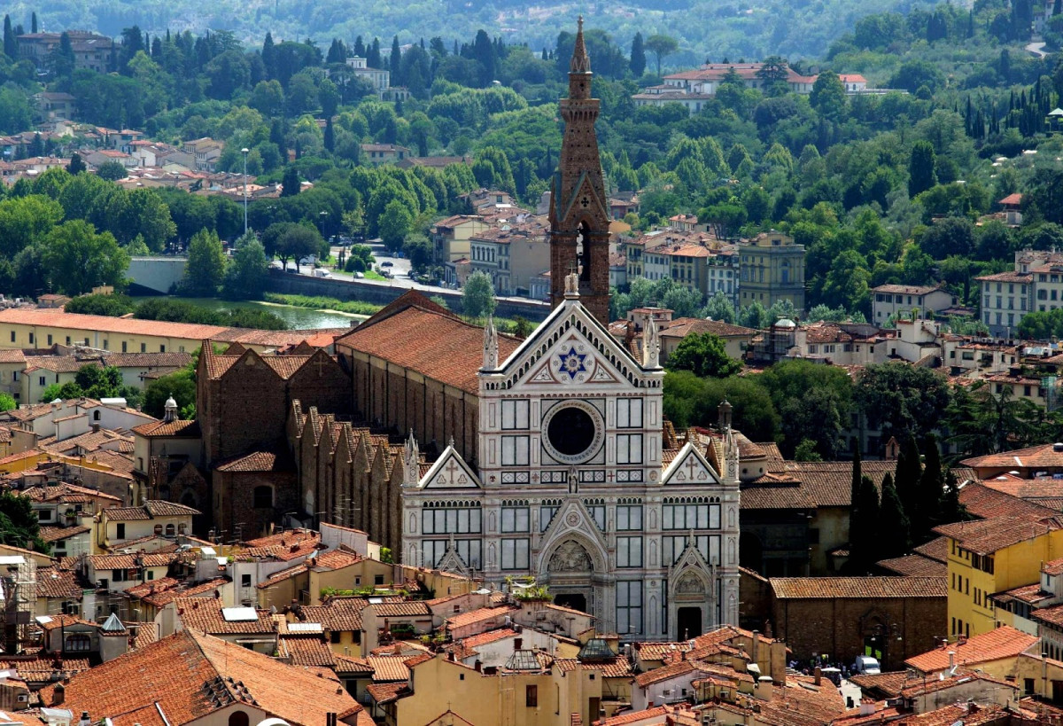 Piazza Santa Croce in Florence with historical buildings and people