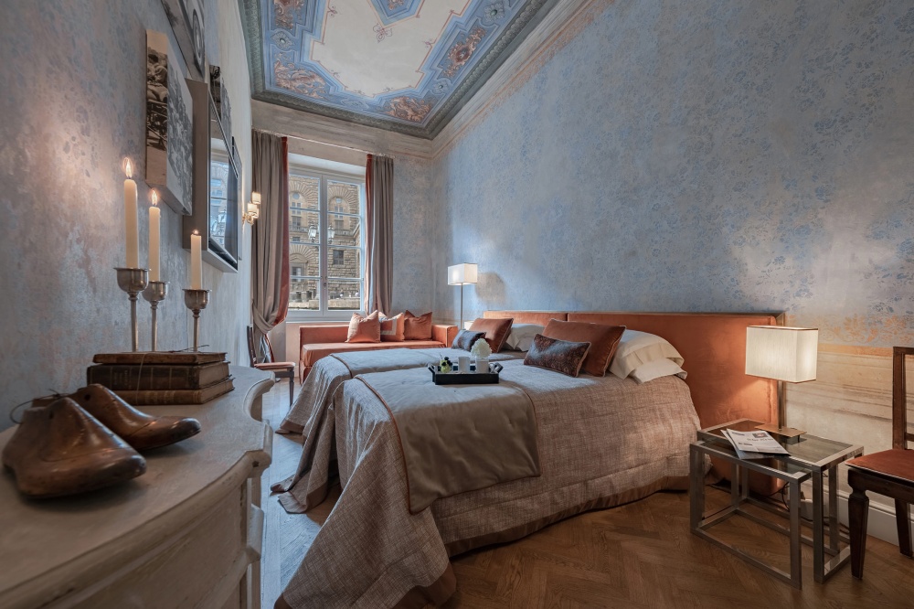 Bedroom of the Pitti Historical Home apartment furnished with quality fabrics