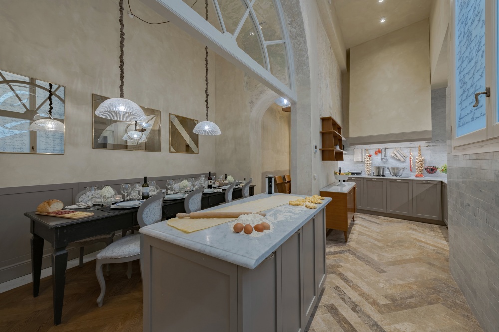 The spacious chef-style kitchen of the Pitti Historical Home apartment