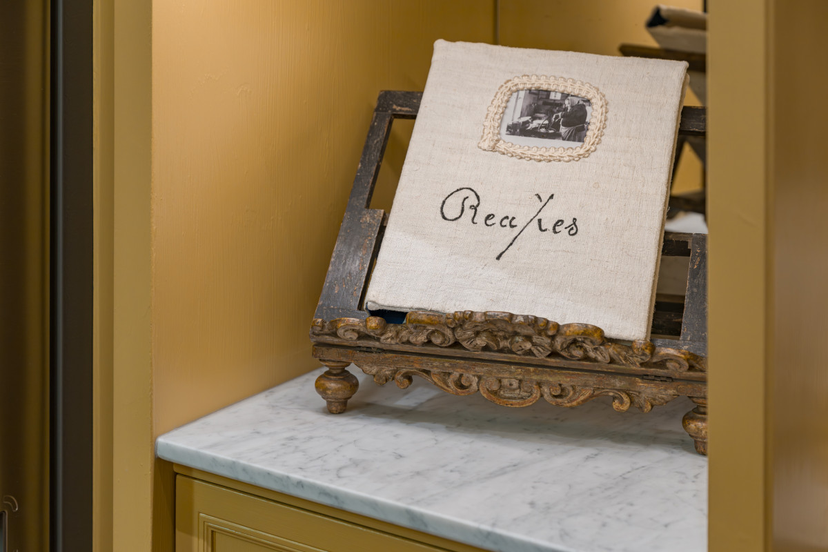 Recipe book detail in traditional kitchen Florence apartment