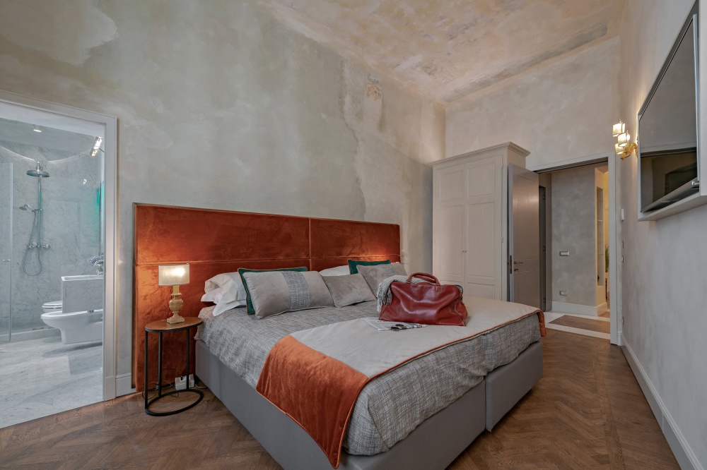 Stylish red bedroom suite in historic apartment in Florence