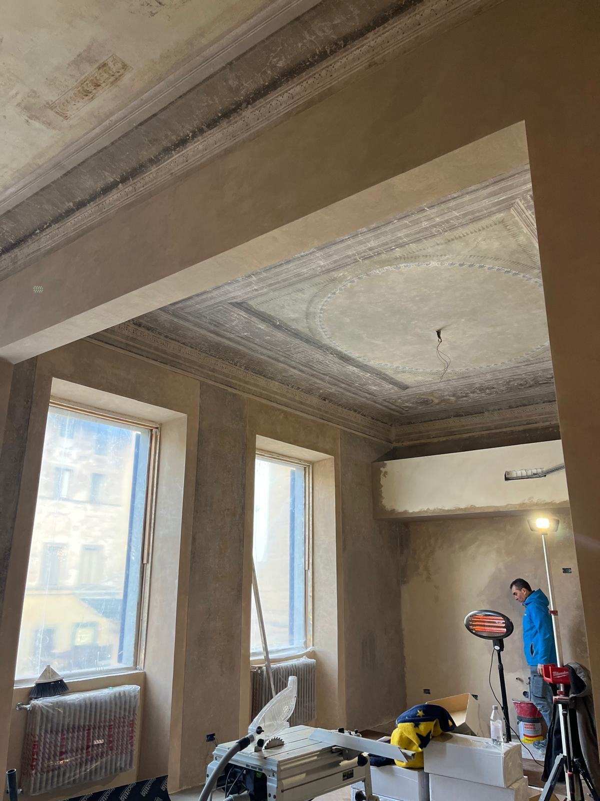 Room with fresco ceiling before restoration in Florence historic home