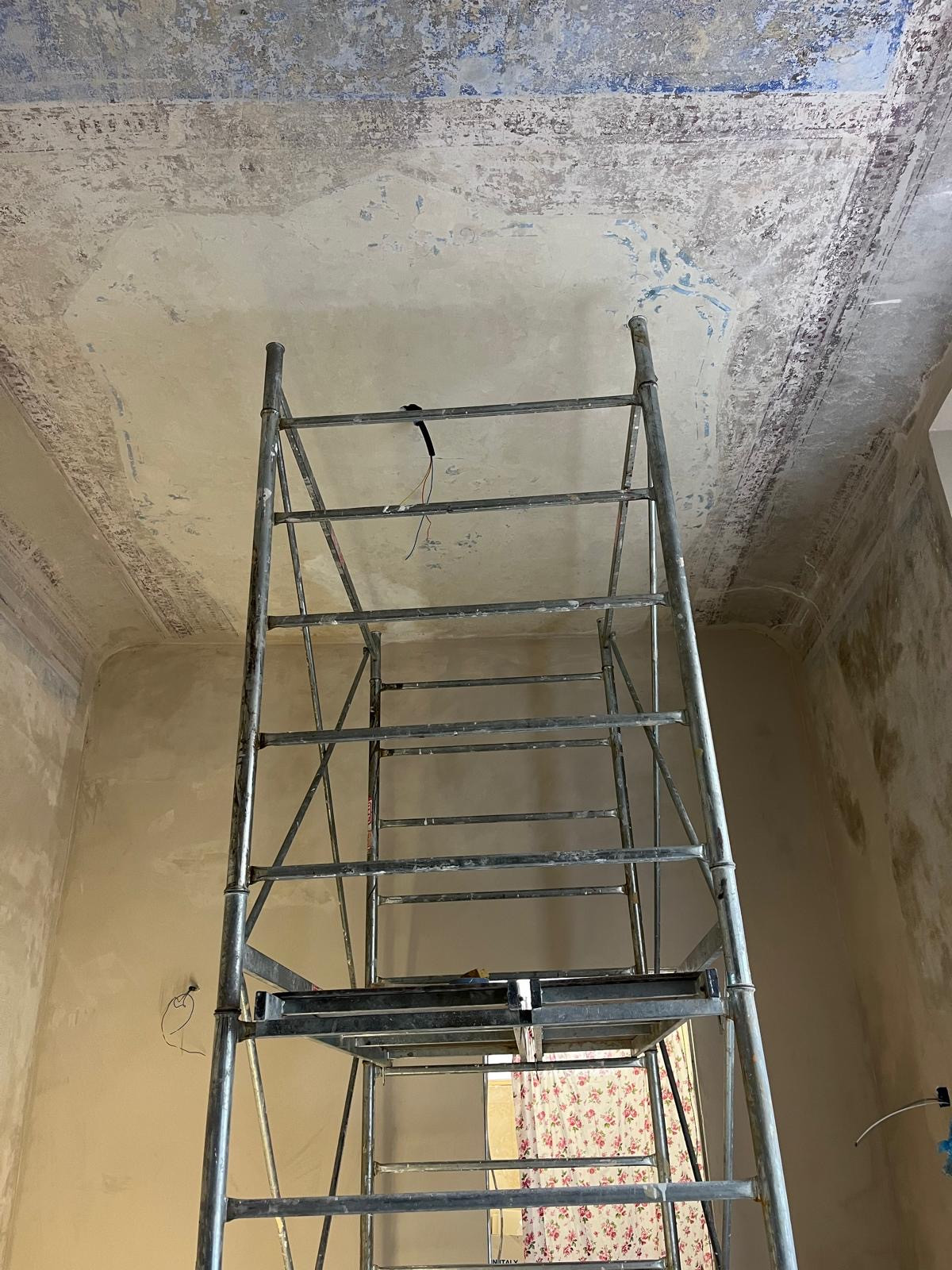 Scaffolding used during ceiling restoration in historic Florence apartment