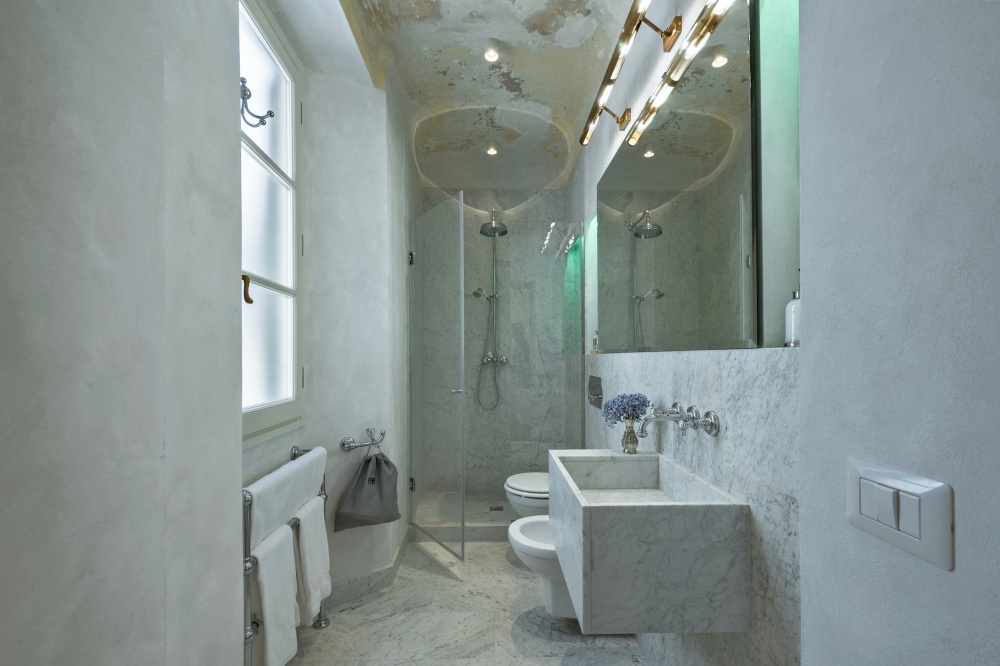 Spa-style bathroom with ambient lighting in luxury Florence apartment