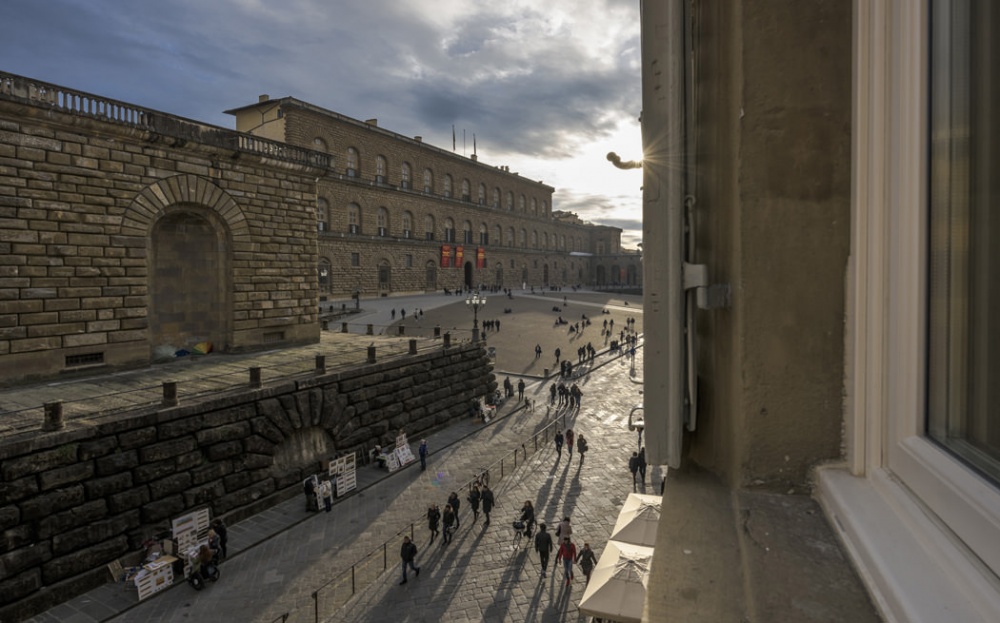 Scenic view of Piazza Pitti and Palazzo Pitti from window of luxury historic apartment in Florence