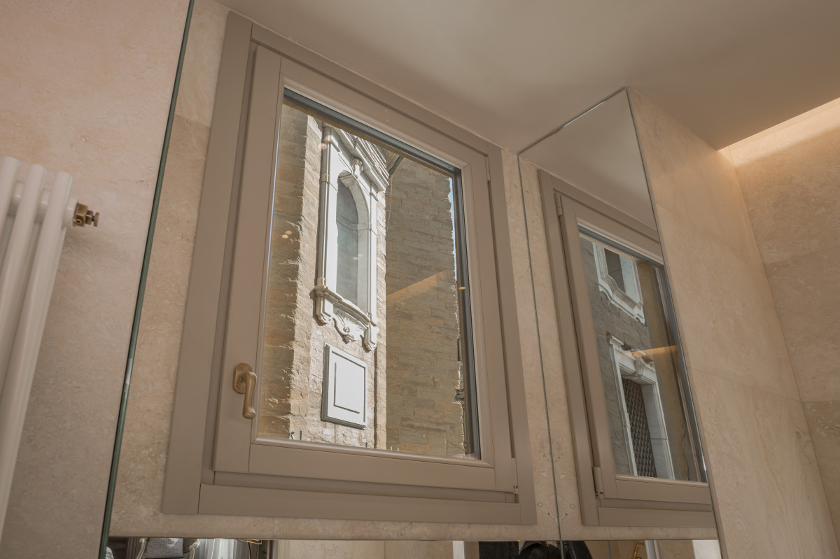 Window detail with historic view in Medici apartment in Florence