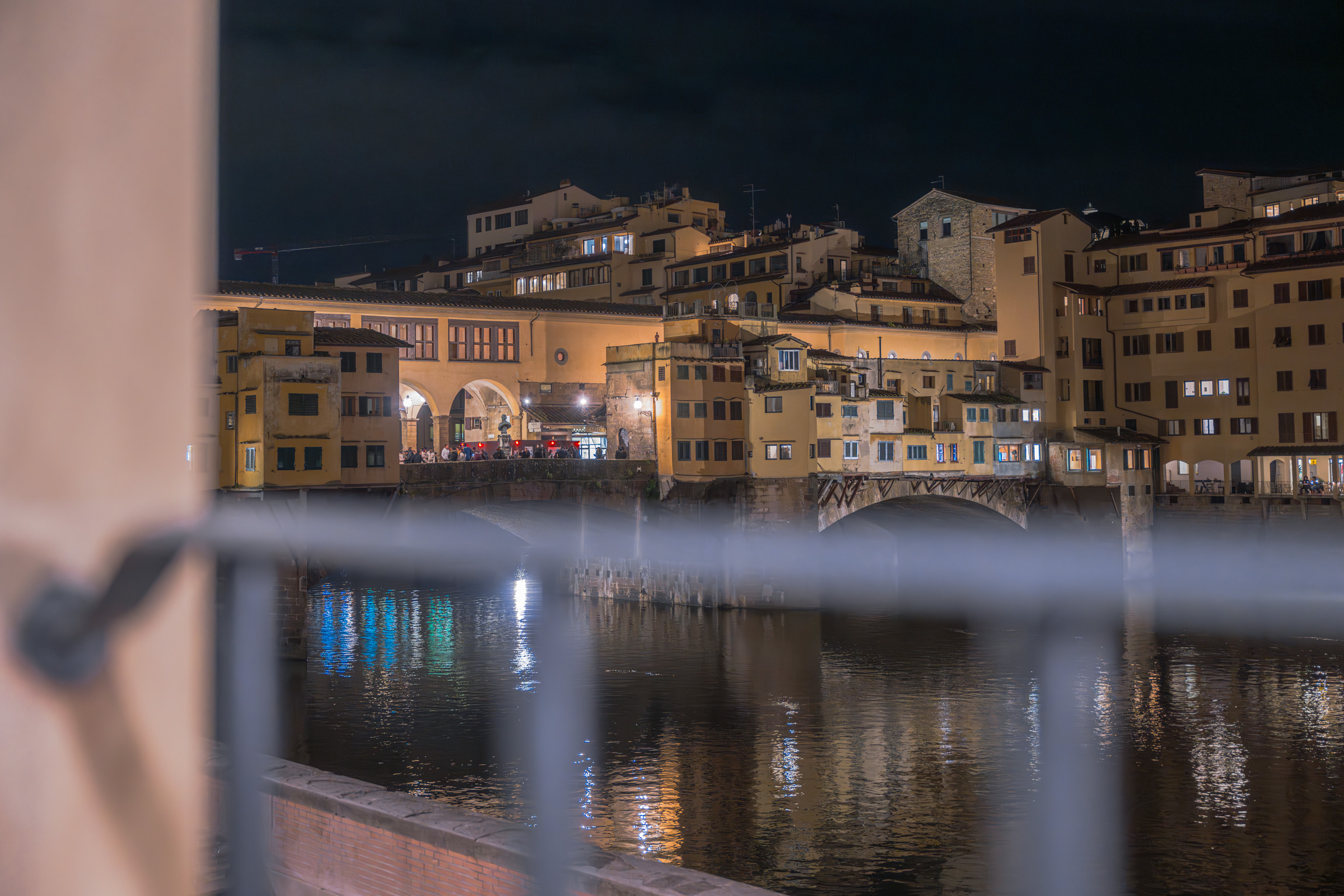 Window detail with view of Arno River in Florence